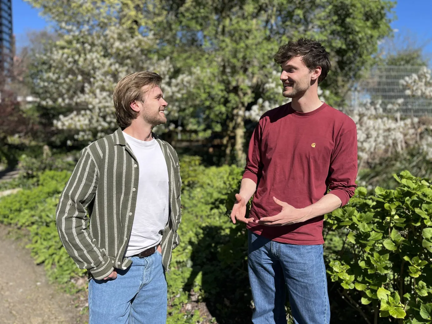 Two members of the Climate Cleanup Foundation team in conversation outdoors
